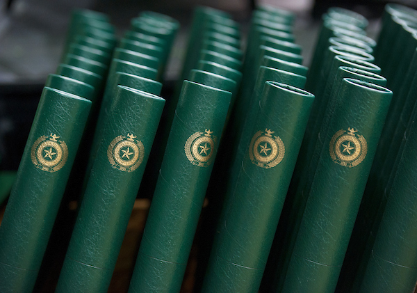 A row of green diplomas