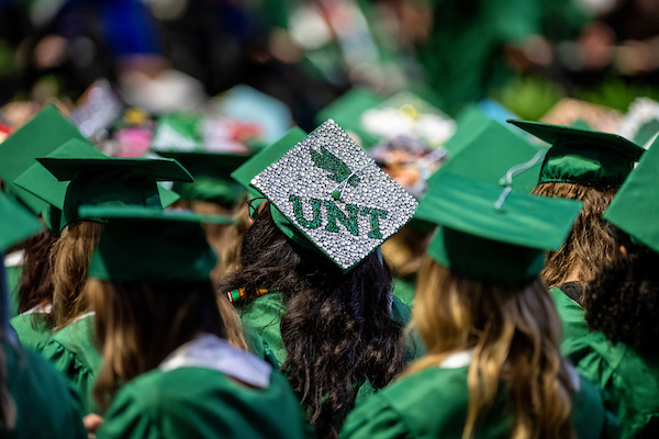 Decorated mortarboards at UNT commencement