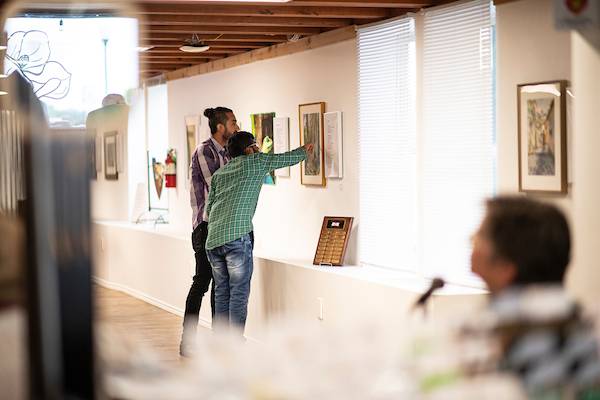 CoLab visitors viewing an art exhibit